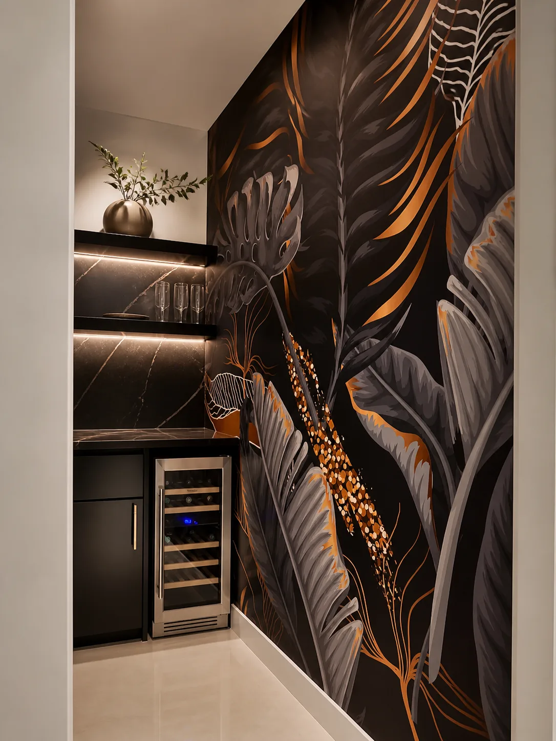 Dark tropical mural with gold accents installed in a butler's pantry with a wine fridge